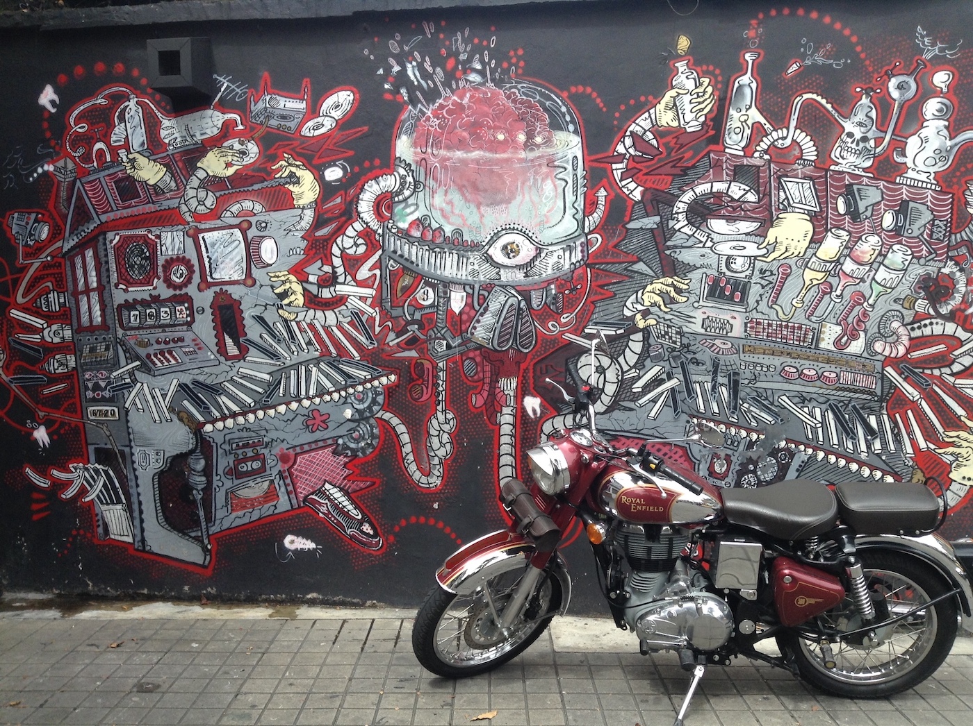 motorcycle in front of mural