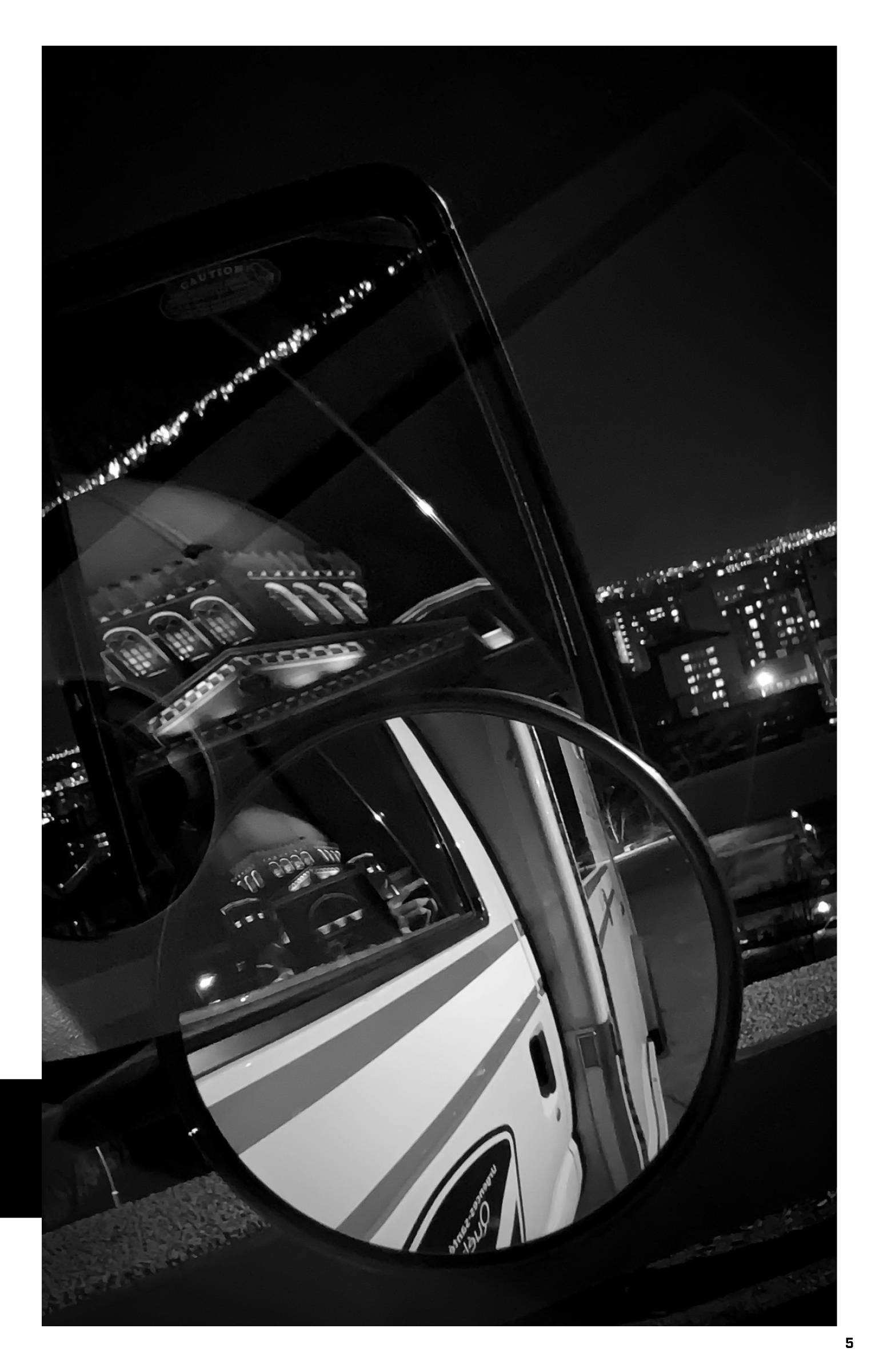 Night photo of reflection of the St. Joseph oratory in the ambulance mirror.